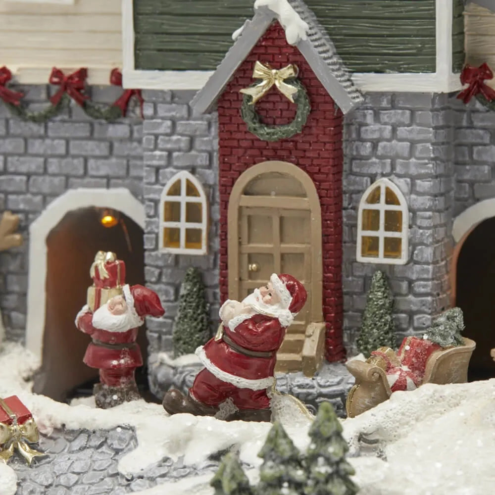 Villaggio Natalizio Luminoso con Babbo Natale e Slitta